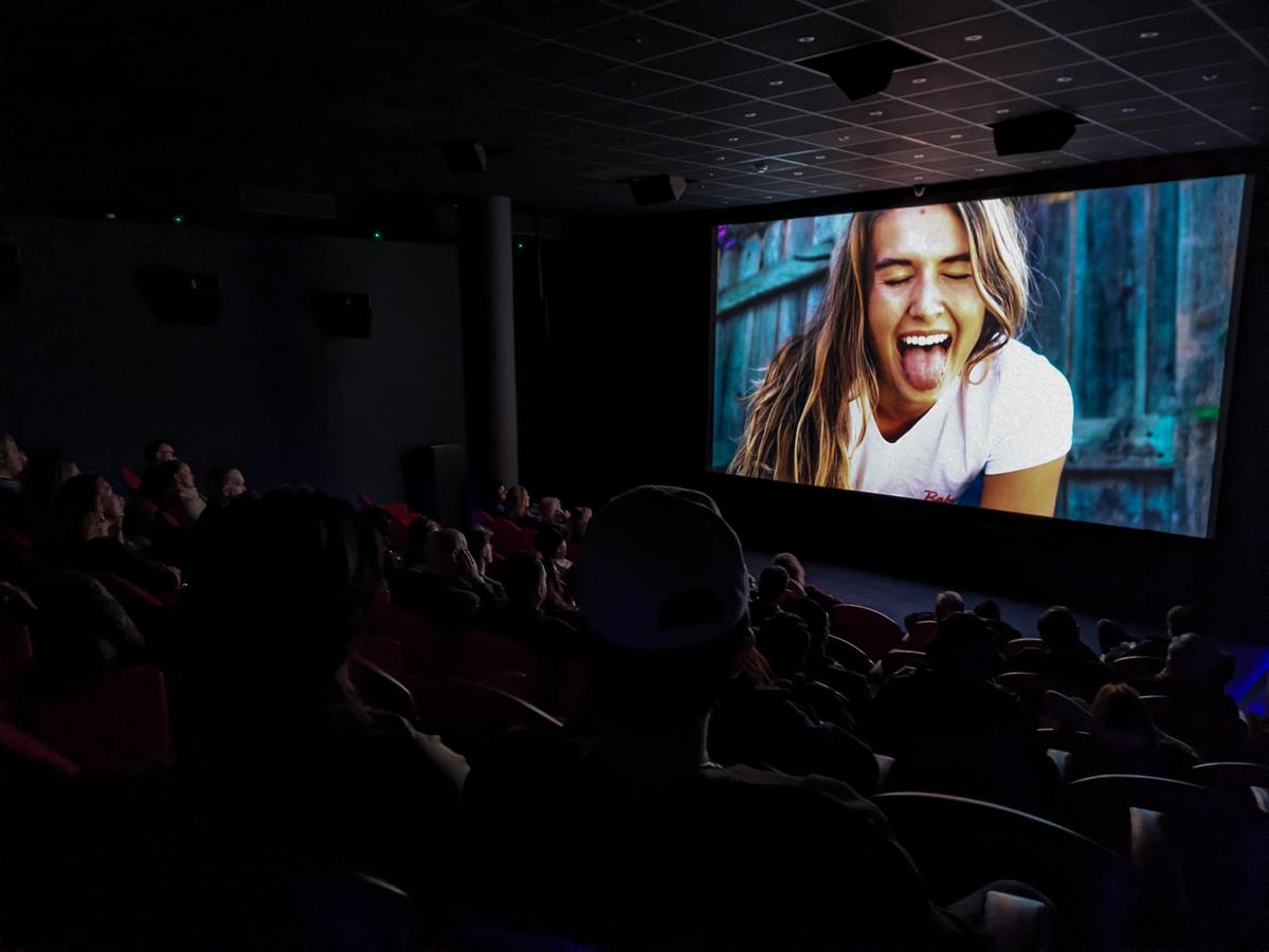 Audience watching Lonely Fans in the theater — global screening tour
